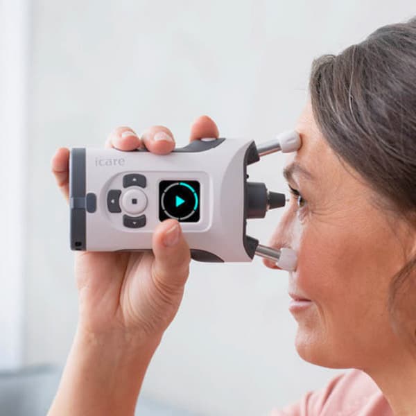 Woman using the iCare HOME2 tonometer